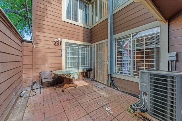 12574 Newbrook Dr, Houston, TX 77072 - view of patio featuring central air condition unit