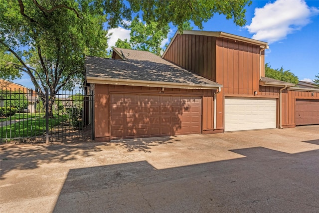 12574 Newbrook Dr, Houston, TX 77072 - garage featuring fence and concrete driveway
