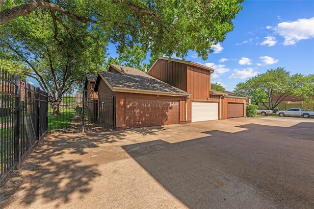 12574 Newbrook Dr, Houston, TX 77072 - garage with fence and driveway