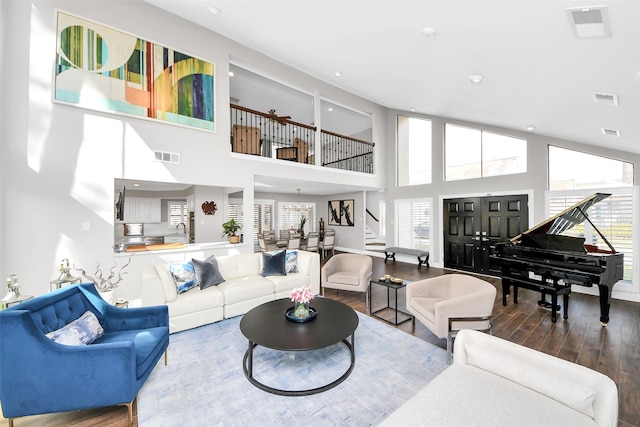 525 Rancho Bauer Dr, Houston, TX 77079 - living room featuring wood finished floors, stairs, a towering ceiling, and recessed lighting
