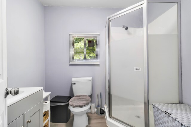 60 W Sierra Rd, Coldspring, TX 77331 - bathroom with a shower stall, vanity, toilet, and wood finished floors