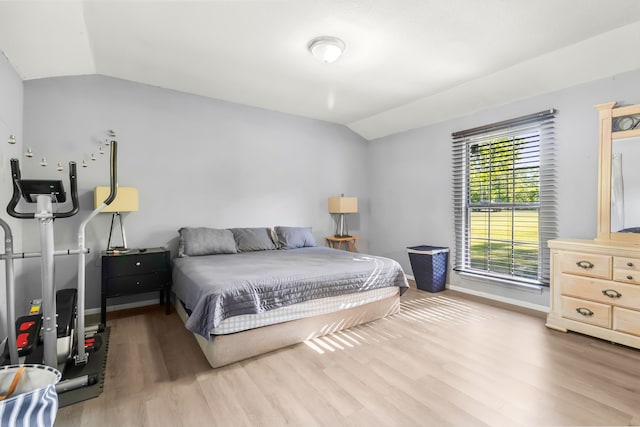 60 W Sierra Rd, Coldspring, TX 77331 - bedroom featuring lofted ceiling, wood finished floors, and baseboards