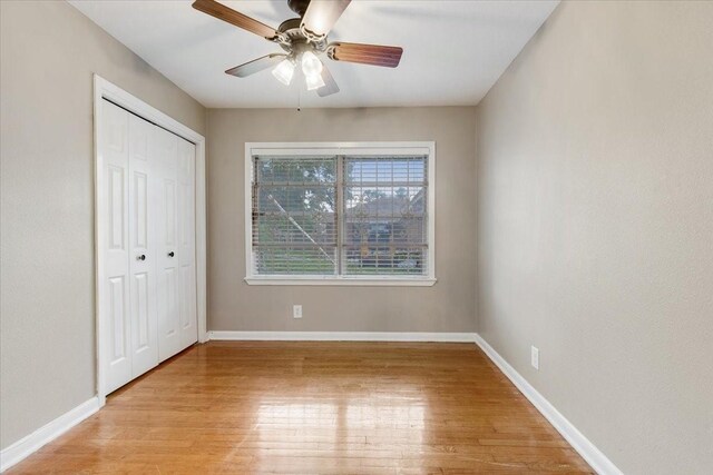 2003 Sieber Dr, Houston, TX 77017 - unfurnished bedroom with light wood finished floors, baseboards, a closet, and a ceiling fan