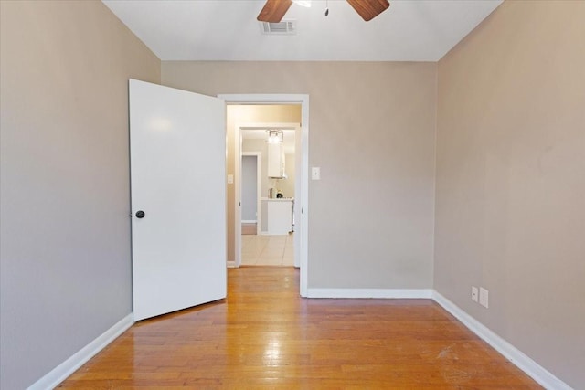 2003 Sieber Dr, Houston, TX 77017 - empty room with a ceiling fan, light wood-style floors, and baseboards