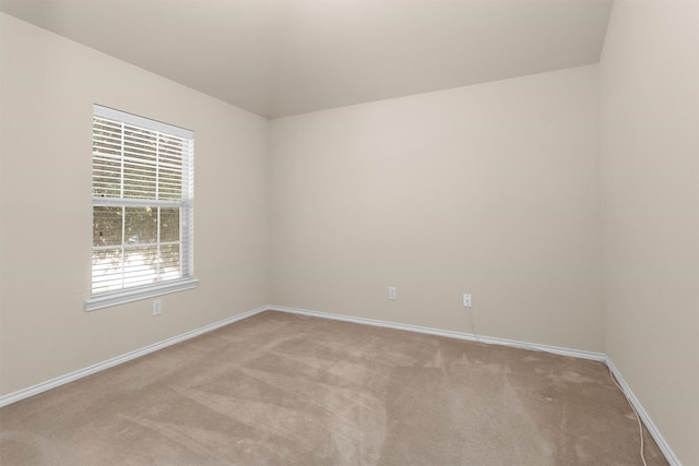 16503 Brightling Ln, Houston, TX 77090 - empty room featuring light carpet and baseboards