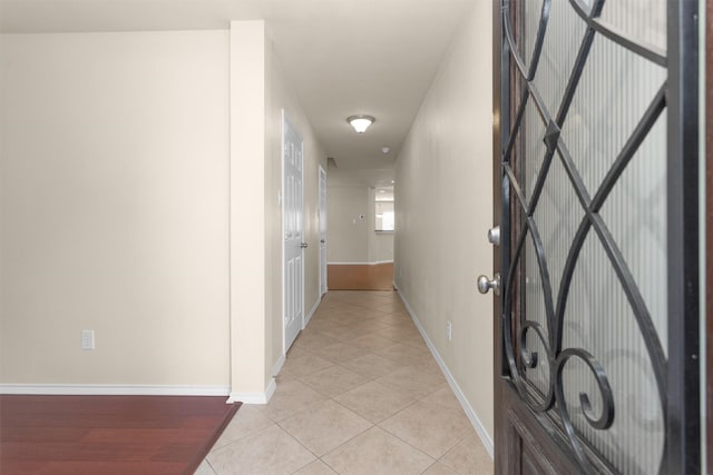 16503 Brightling Ln, Houston, TX 77090 - corridor with light tile patterned floors and baseboards