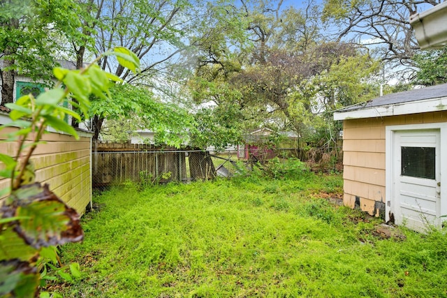1306 Laurel St, La Marque, TX 77568 - fenced backyard with an outbuilding