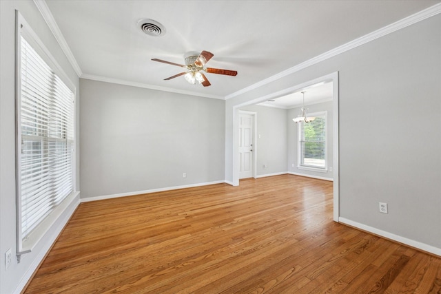 2322 Lamonte Ln, Houston, TX 77018 - empty room with light wood finished floors, ceiling fan, baseboards, and crown molding