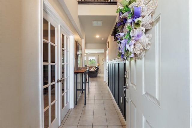6303 Lemon Balm Ln, Crosby, TX 77532 - hall with french doors, light tile patterned floors, and recessed lighting