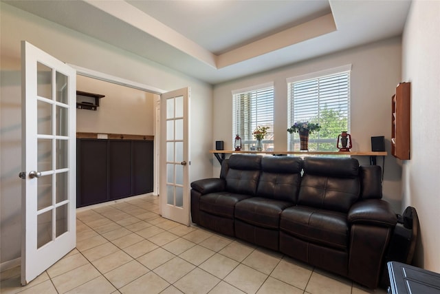 6303 Lemon Balm Ln, Crosby, TX 77532 - tiled living room with french doors, a raised ceiling, and baseboards