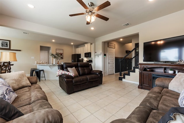 6303 Lemon Balm Ln, Crosby, TX 77532 - living area with light tile patterned floors, a ceiling fan, stairway, and recessed lighting