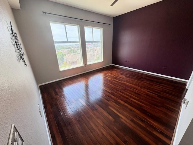 3505 Sage Rd Unit 602, Houston, TX 77056 - spare room with wood-type flooring, baseboards, and a ceiling fan