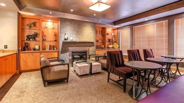 3505 Sage Rd Unit 602, Houston, TX 77056 - carpeted dining space with a large fireplace, a raised ceiling, recessed lighting, and built in shelves