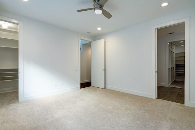 2356 Commerce, Houston, TX 77003 - unfurnished bedroom with a spacious closet, carpet, recessed lighting, and a closet