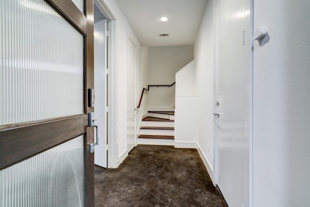 2356 Commerce, Houston, TX 77003 - hallway featuring concrete flooring, stairway, and baseboards