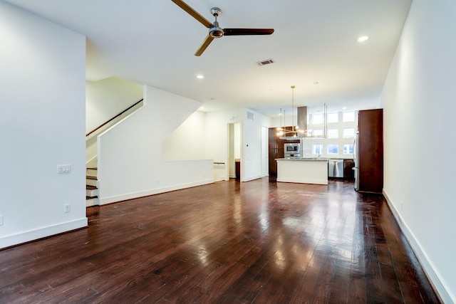 2356 Commerce, Houston, TX 77003 - unfurnished living room with dark wood-style floors, ceiling fan, stairs, baseboards, and recessed lighting