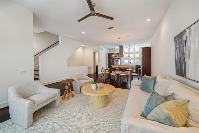 2356 Commerce, Houston, TX 77003 - living area featuring a ceiling fan, stairs, recessed lighting, wood finished floors, and a chandelier