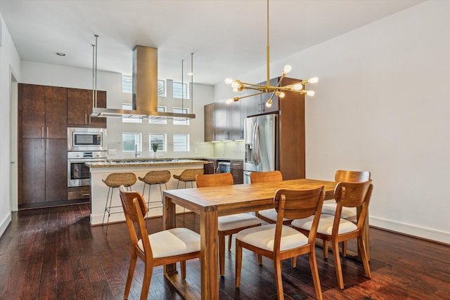 2356 Commerce, Houston, TX 77003 - dining area with dark wood-type flooring and baseboards