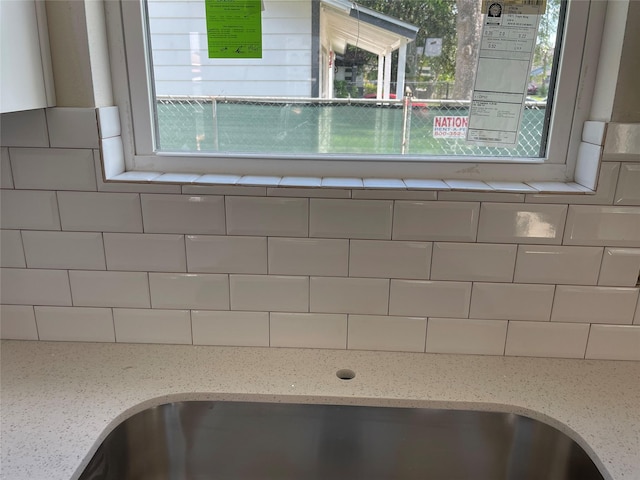 6322 Sayers St, Houston, TX 77026 - kitchen view of decorative backsplash and light stone countertops