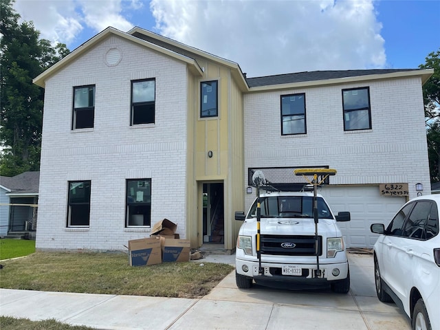 6322 Sayers St, Houston, TX 77026 - view of front of property featuring brick siding and an attached garage
