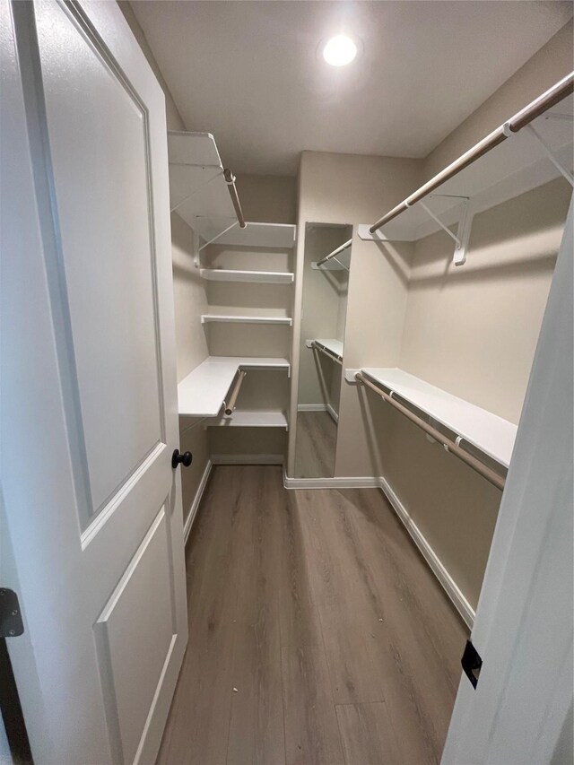6322 Sayers St, Houston, TX 77026 - walk in closet featuring wood finished floors
