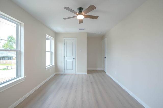 6322 Sayers St, Houston, TX 77026 - unfurnished room featuring light wood finished floors and ceiling fan
