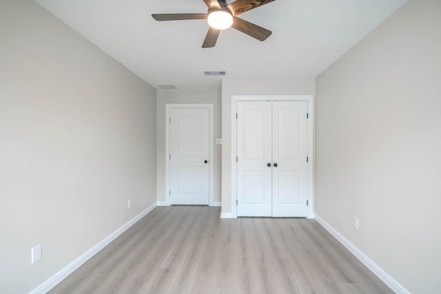 6322 Sayers St, Houston, TX 77026 - unfurnished bedroom featuring light wood-type flooring, a closet, and a ceiling fan