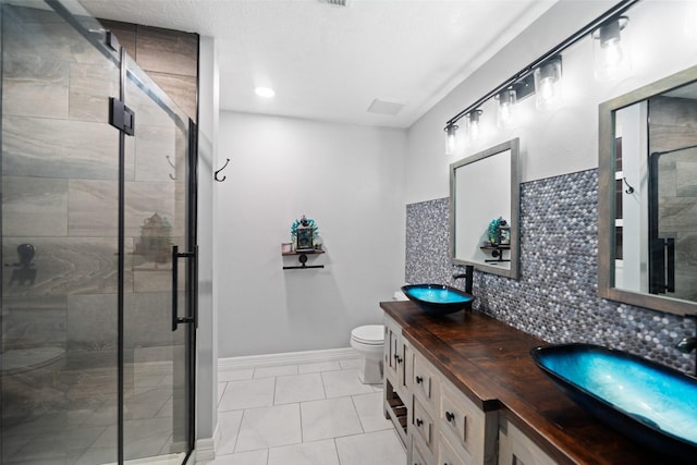 28707 Stapleford St, Spring, TX 77386 - full bath featuring double vanity, toilet, a shower stall, and tile patterned floors