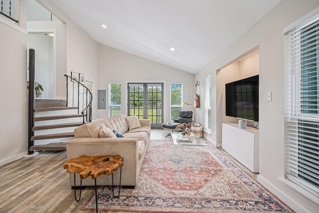 817 Bryan Ave, Seabrook, TX 77586 - living room featuring vaulted ceiling, wood finished floors, stairway, baseboards, and recessed lighting