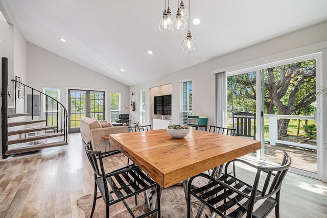 817 Bryan Ave, Seabrook, TX 77586 - dining space featuring plenty of natural light, light wood-type flooring, stairs, recessed lighting, and high vaulted ceiling