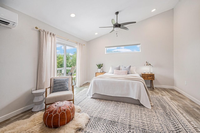 817 Bryan Ave, Seabrook, TX 77586 - bedroom featuring light wood-type flooring, a wall mounted air conditioner, baseboards, lofted ceiling, and recessed lighting