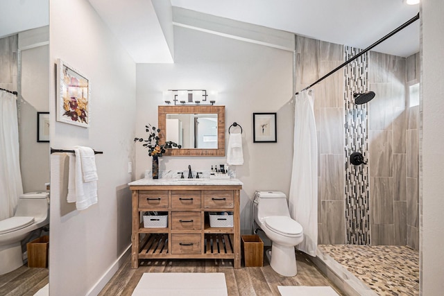 817 Bryan Ave, Seabrook, TX 77586 - full bathroom featuring toilet, wood finished floors, vanity, and tiled shower
