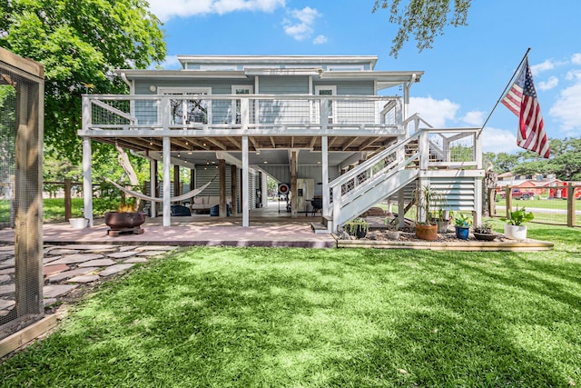 817 Bryan Ave, Seabrook, TX 77586 - rear view of house with stairs, a patio, a yard, and a wooden deck