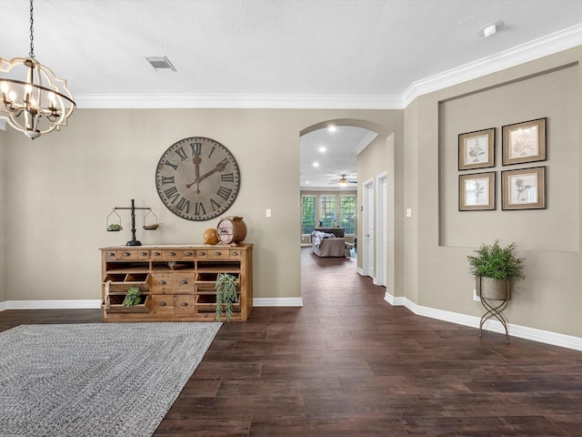 2815 Halton Ct, Kingwood, TX 77345 - hallway with arched walkways, dark wood-type flooring, a chandelier, ornamental molding, and baseboards