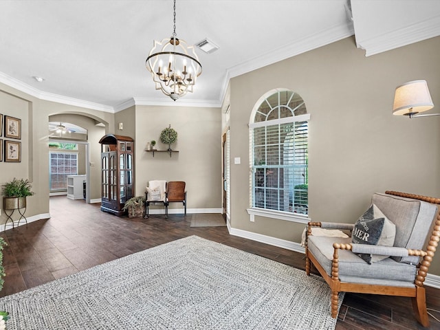 2815 Halton Ct, Kingwood, TX 77345 - sitting room with wood finished floors, a chandelier, ornamental molding, arched walkways, and baseboards