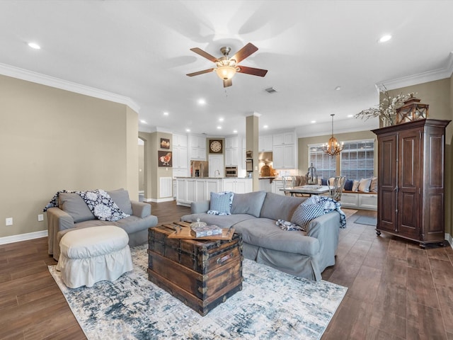2815 Halton Ct, Kingwood, TX 77345 - living room featuring a ceiling fan, crown molding, a chandelier, baseboards, and dark wood finished floors