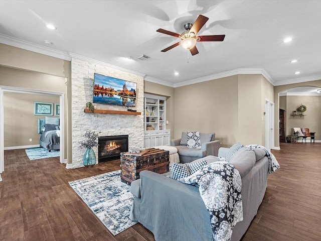 2815 Halton Ct, Kingwood, TX 77345 - living area with ceiling fan, arched walkways, wood finished floors, crown molding, and recessed lighting