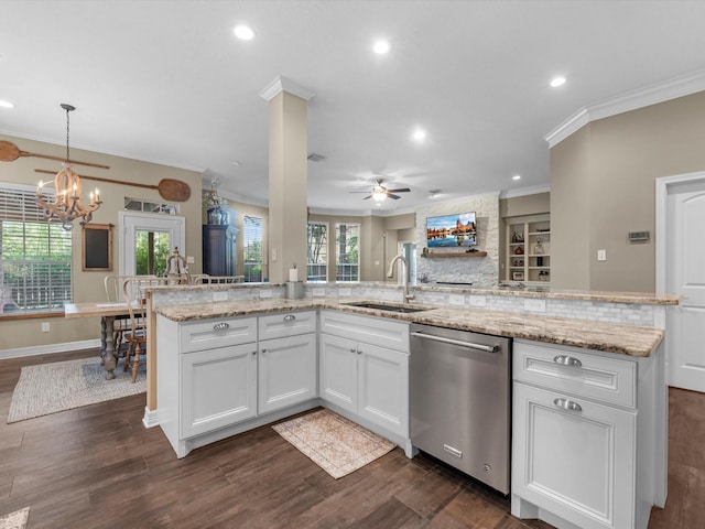 2815 Halton Ct, Kingwood, TX 77345 - kitchen with stainless steel dishwasher, a sink, ceiling fan, open floor plan, and crown molding