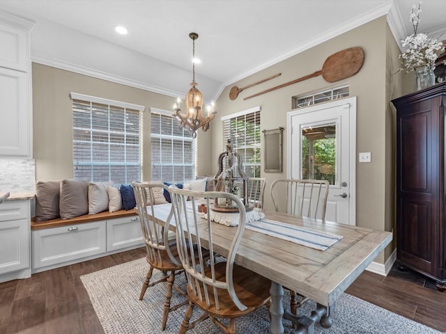 2815 Halton Ct, Kingwood, TX 77345 - dining room with crown molding, a chandelier, and dark wood-type flooring
