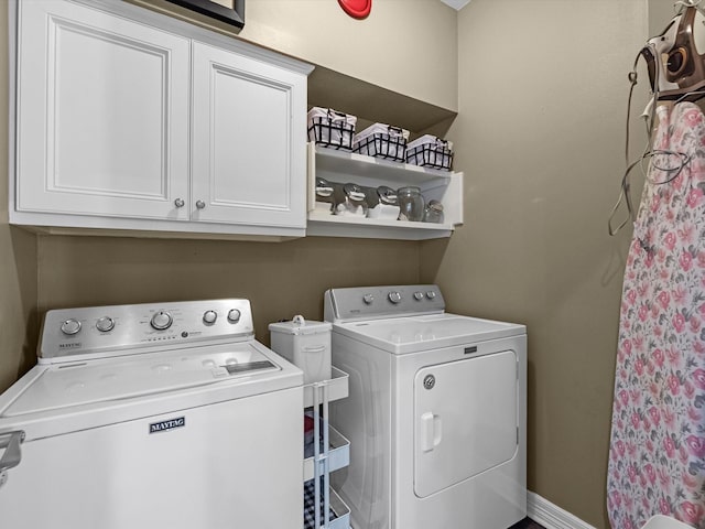 2815 Halton Ct, Kingwood, TX 77345 - laundry room with washer and clothes dryer and cabinet space