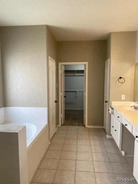 17523 Ginger Fields Ln, Tomball, TX 77377 - full bathroom with tile patterned flooring, a bath, vanity, and a spacious closet