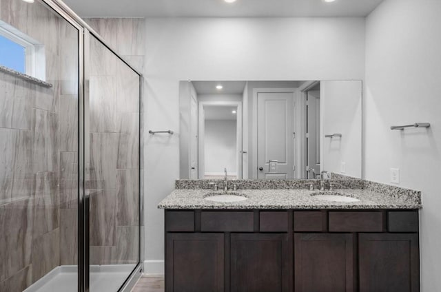 8802 Cecil Garden Ln, Cypress, TX 77433 - bathroom with a stall shower, double vanity, and recessed lighting