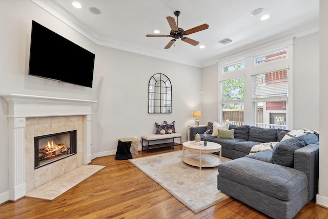 2024 Singleton St, Houston, TX 77008 - living area with ceiling fan, light wood-style flooring, crown molding, a fireplace, and recessed lighting