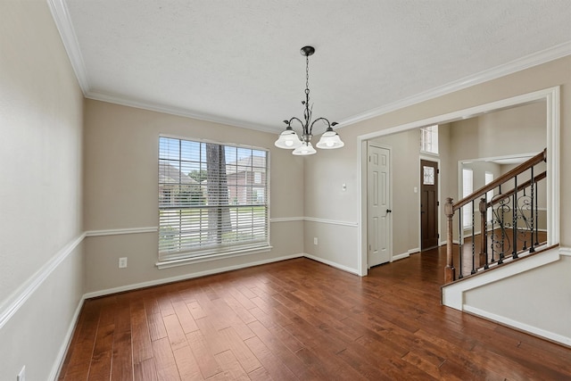19042 Keyturn Ln, Humble, TX 77346 - empty room with a chandelier, ornamental molding, hardwood / wood-style floors, baseboards, and stairs