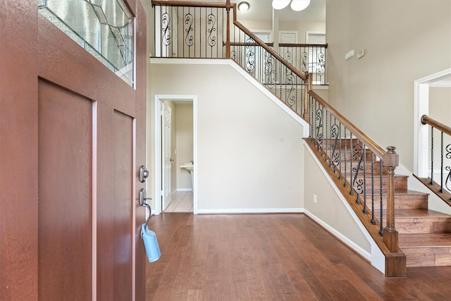 19042 Keyturn Ln, Humble, TX 77346 - entrance foyer with hardwood / wood-style flooring, a high ceiling, baseboards, and stairs