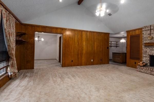 3314 Park Meadows Ave, Deer Park, TX 77536 - unfurnished living room featuring light carpet, a brick fireplace, wooden walls, high vaulted ceiling, and beamed ceiling