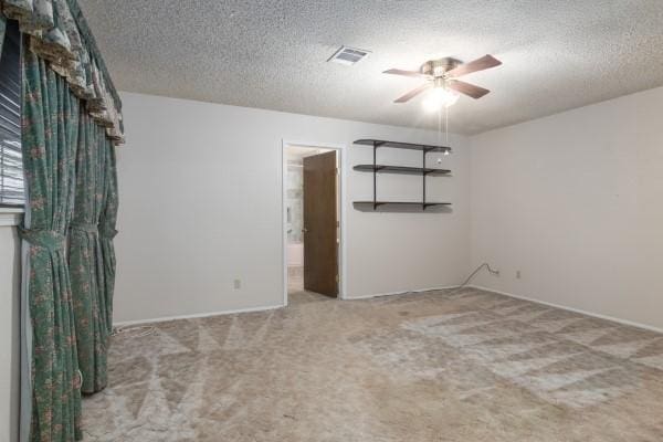 3314 Park Meadows Ave, Deer Park, TX 77536 - empty room featuring ceiling fan, a textured ceiling, carpet flooring, and baseboards