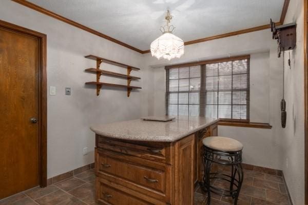 3314 Park Meadows Ave, Deer Park, TX 77536 - kitchen with brown cabinets, ornamental molding, baseboards, a chandelier, and pendant lighting