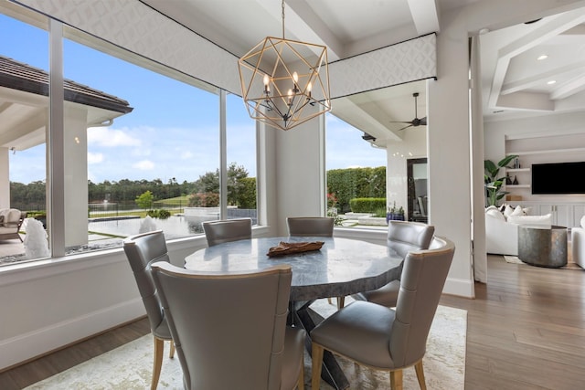 23314 Vista De Tres Lagos Dr, Spring, TX 77389 - sunroom / solarium featuring a water view, a chandelier, beam ceiling, and view of scattered trees
