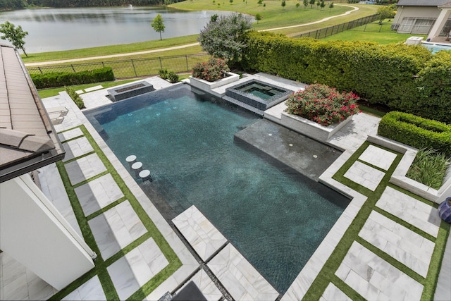 23314 Vista De Tres Lagos Dr, Spring, TX 77389 - view of swimming pool featuring a water view, a patio, and a pool with connected hot tub